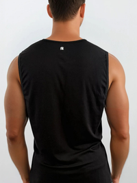 Person wearing a black sleeveless shirt with a logo on the back against a white background