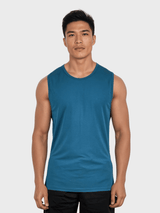 Man wearing a teal sleeveless shirt against a white background