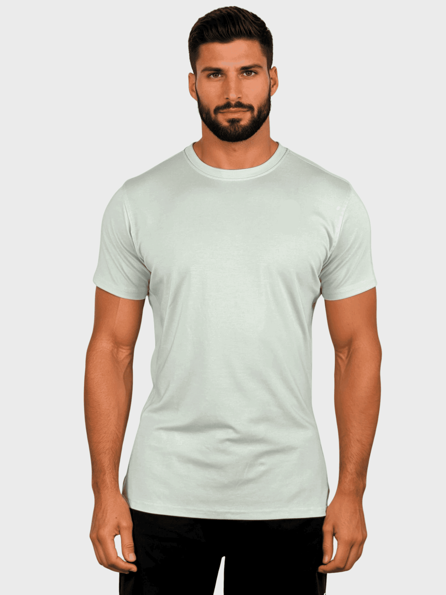 Man wearing a light green t-shirt against a plain background