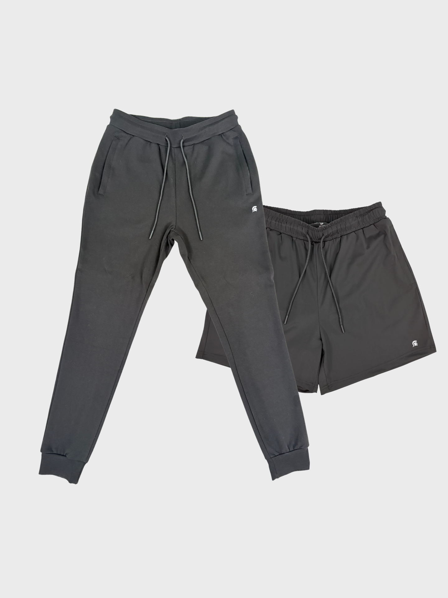 Gray sweatpants and shorts set on a light gray background