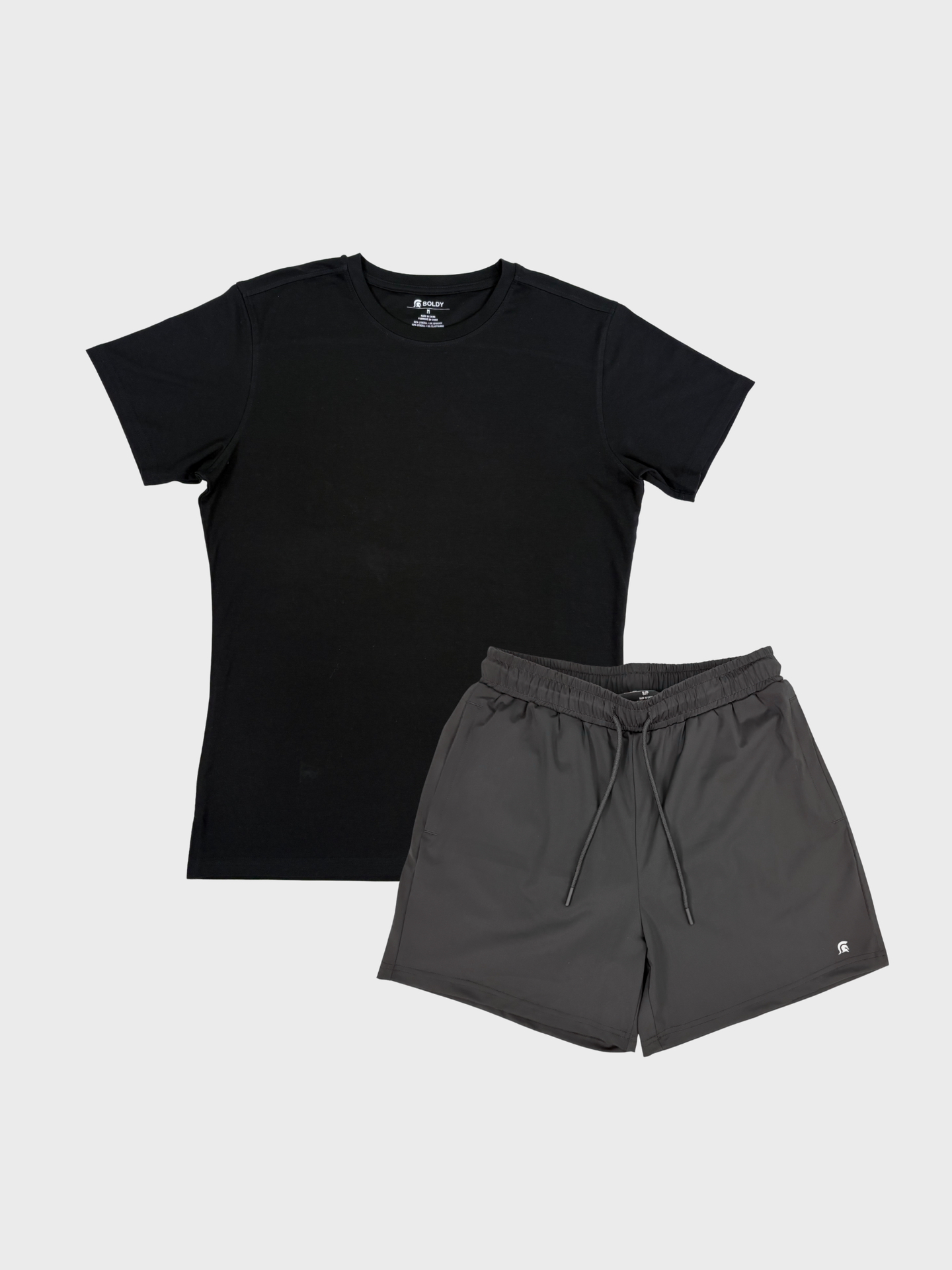Black t-shirt and gray shorts on a light gray background